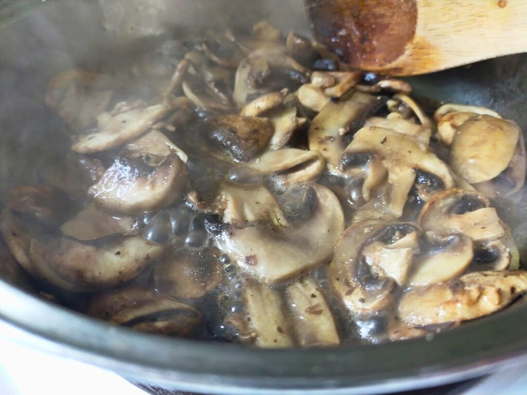 Sliced mushrooms creamed in a pot