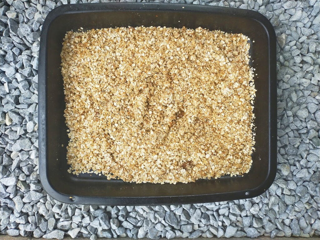 Ingredients for wheat free cheesecake base in a pan ready to bake.