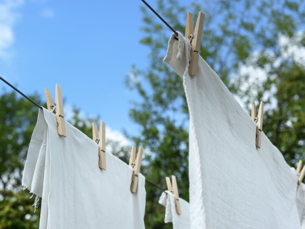 Washing line with white cloth pegged up to dry. Another great screen free activity for kids.