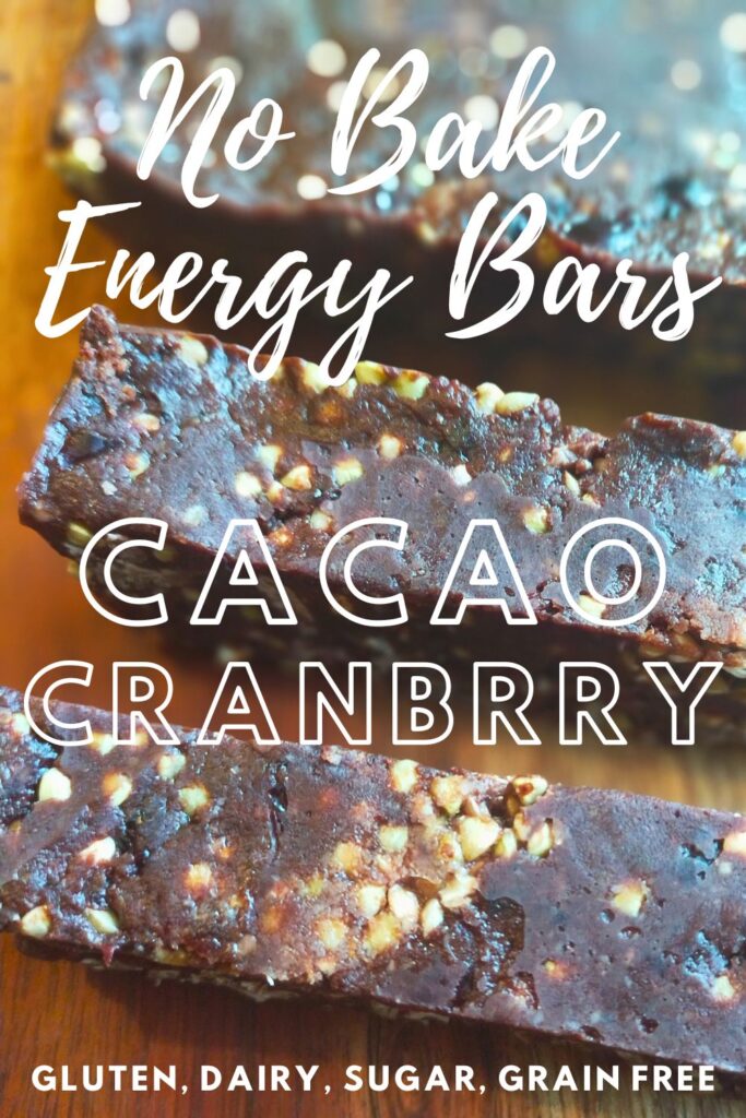 Sliced energy bars sitting on a wooden cutting board PIN