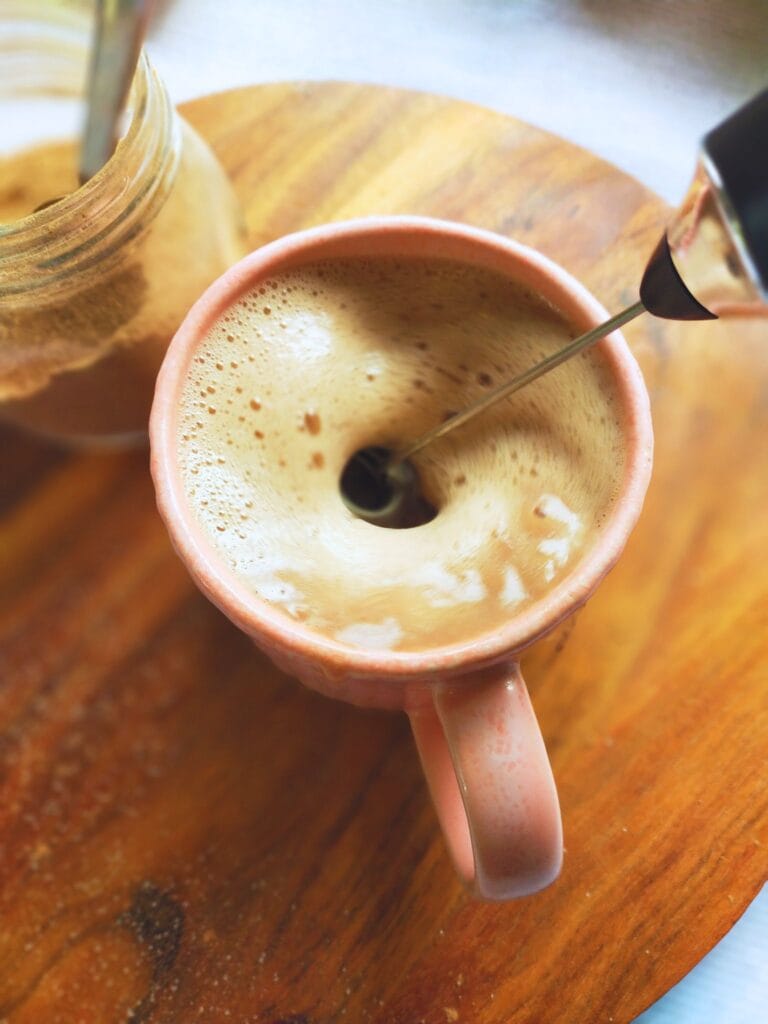 frothing the milk for a hot chocolate drink